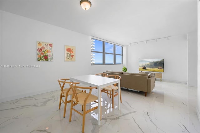 dining room featuring light tile floors