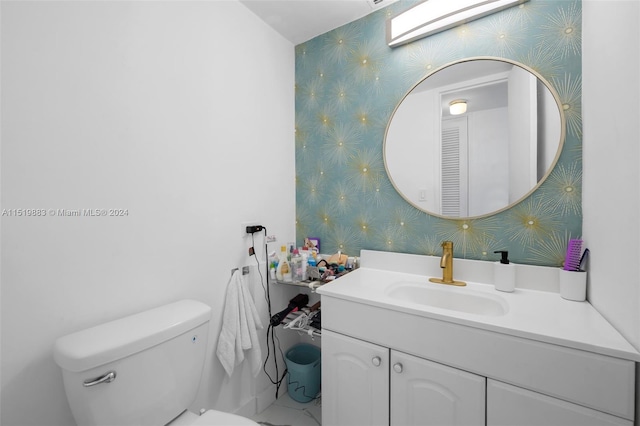 bathroom featuring large vanity and toilet