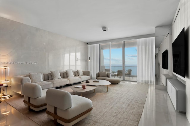 living room featuring floor to ceiling windows