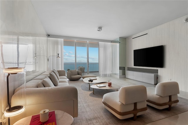 living room featuring floor to ceiling windows