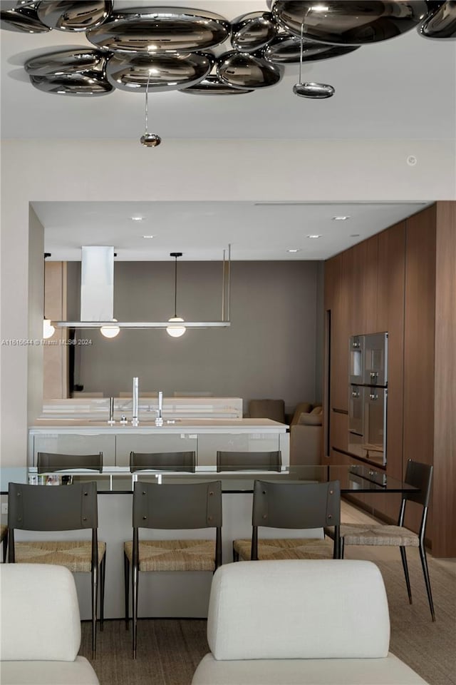 kitchen with wood walls and carpet