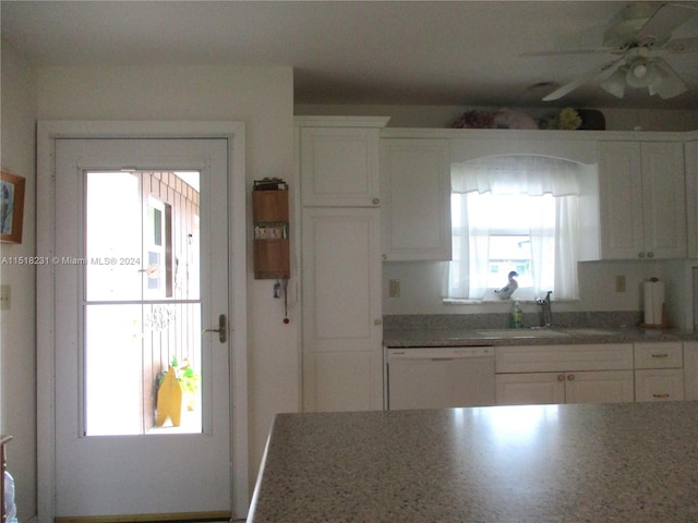 kitchen with ceiling fan, sink, white cabinets, and dishwasher