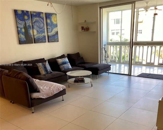 tiled living area featuring floor to ceiling windows