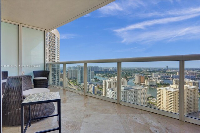 balcony featuring a water view