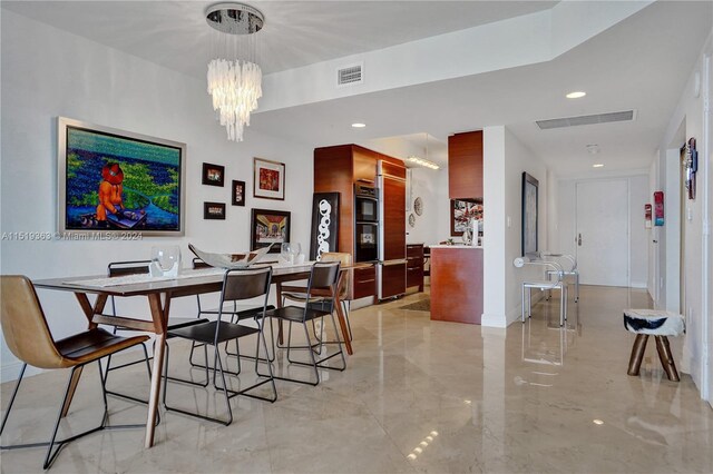 dining room with a notable chandelier