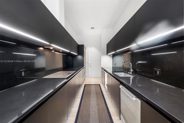 kitchen featuring backsplash, dishwasher, black electric cooktop, and sink