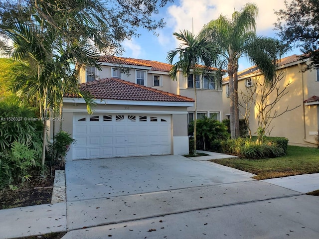 mediterranean / spanish-style house featuring a garage