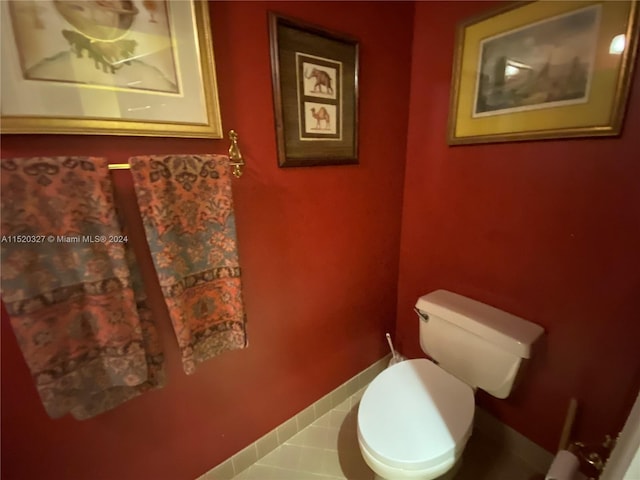 bathroom with tile floors and toilet