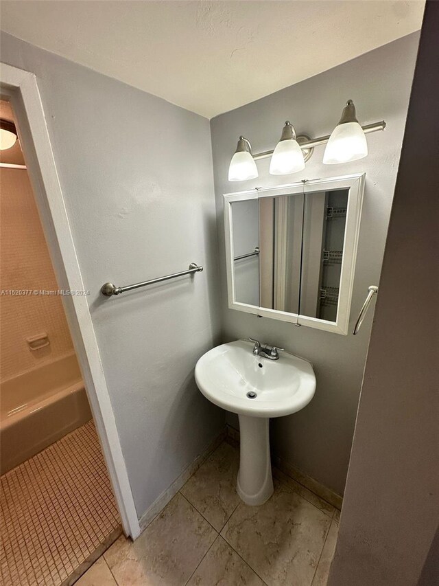 bathroom with tile patterned floors