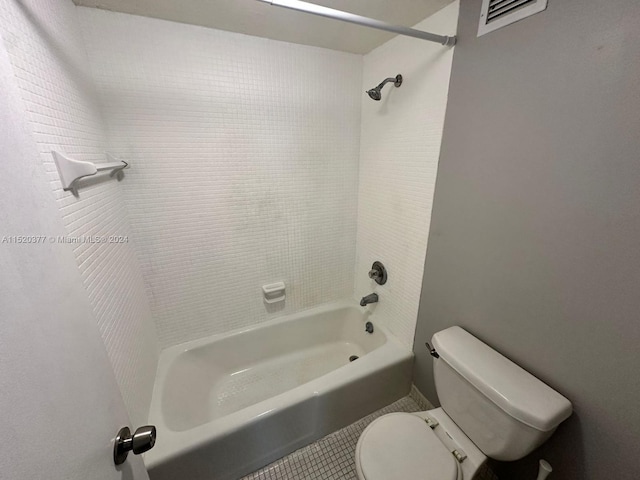 bathroom featuring tile patterned flooring,  shower combination, and toilet