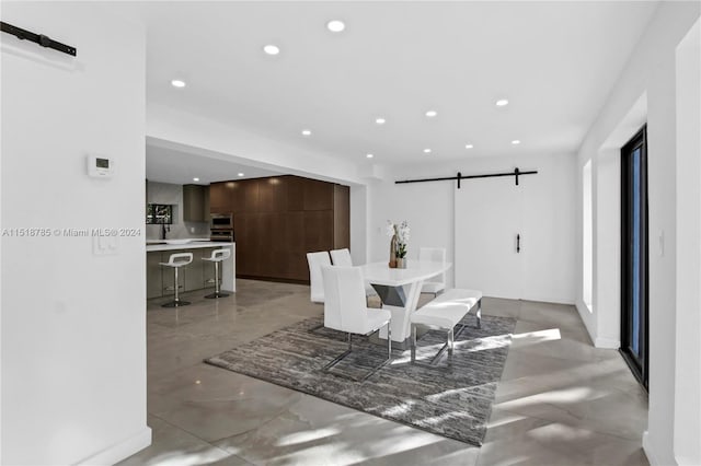 dining area with a barn door