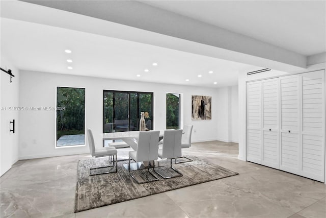 dining area with a barn door