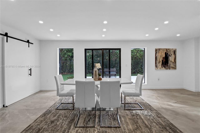 dining area with a barn door