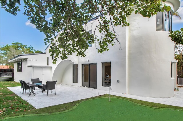 back of house featuring a patio and central AC