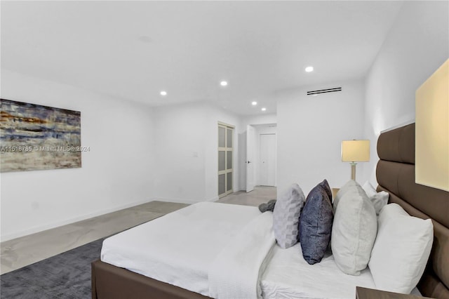 bedroom featuring concrete floors