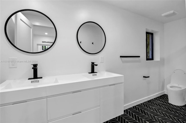 bathroom with dual bowl vanity and tile flooring