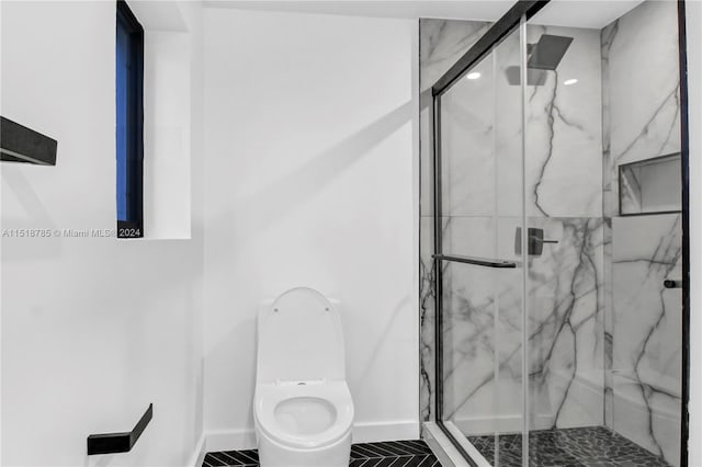 bathroom with walk in shower, toilet, and tile floors