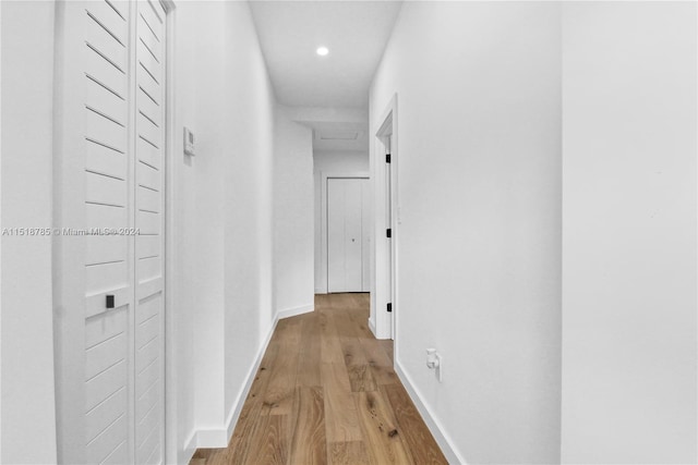 corridor with light wood-type flooring