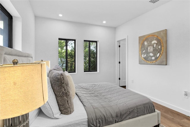 bedroom featuring hardwood / wood-style flooring