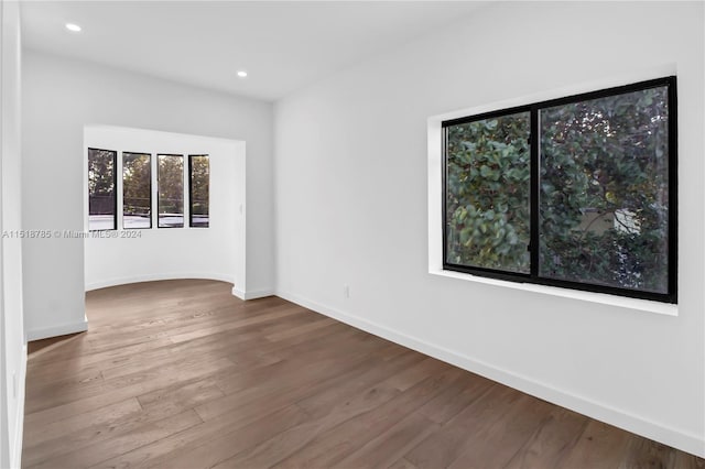 empty room with wood-type flooring