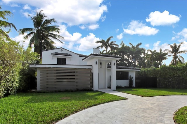 view of front of home with a front lawn