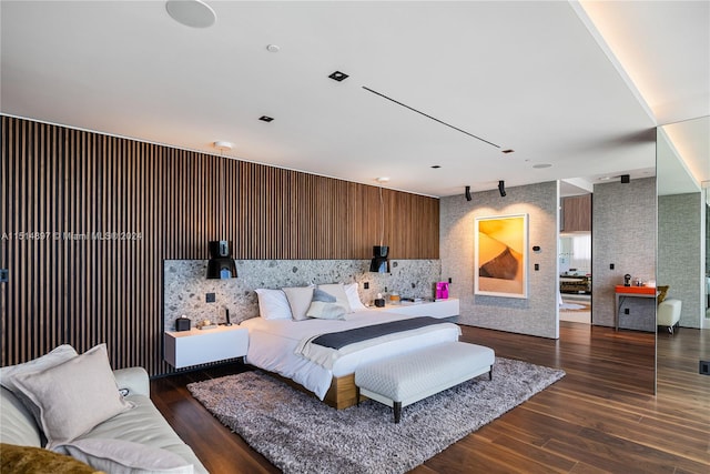 bedroom with dark wood-type flooring