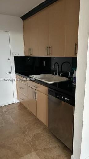 kitchen with light brown cabinetry, light tile floors, dishwasher, and sink