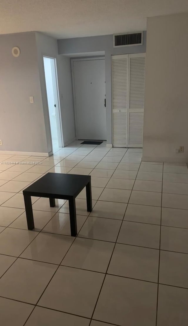 hallway with light tile floors