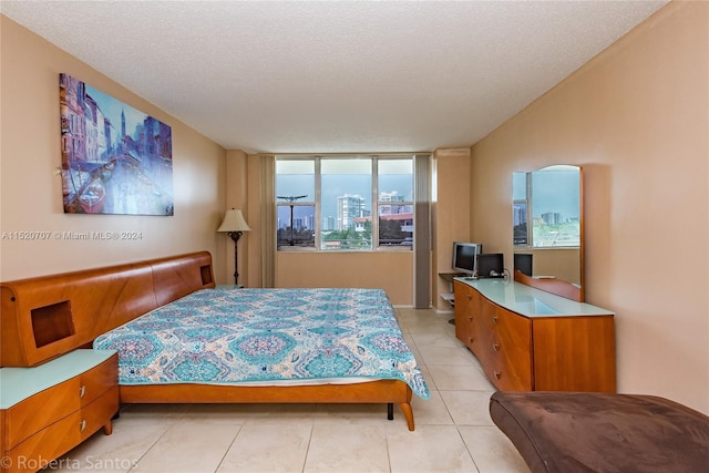 tiled bedroom with a textured ceiling