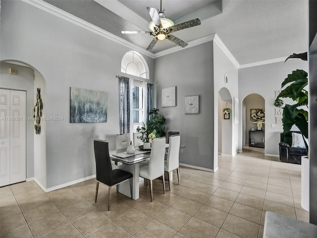 dining space with light tile floors, a textured ceiling, crown molding, and ceiling fan