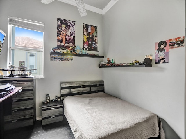 bedroom featuring ornamental molding and dark wood-type flooring