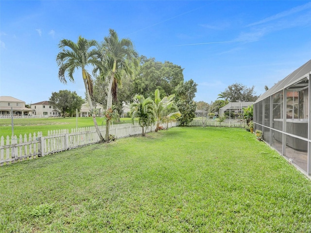 view of yard featuring a lanai