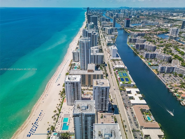 aerial view featuring a view of the beach and a water view