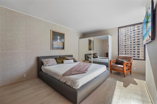 bedroom featuring light wood-type flooring