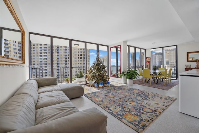 living room featuring floor to ceiling windows