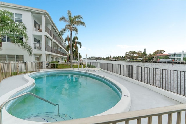 view of pool featuring a water view