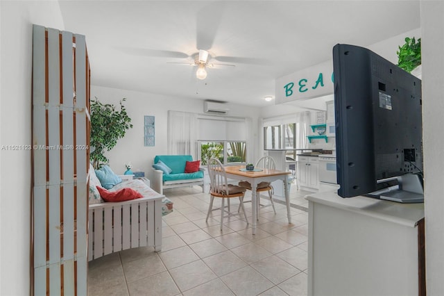 dining space with light tile patterned floors, ceiling fan, and a wall mounted AC