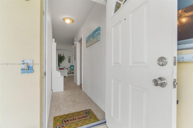 hall with light tile patterned flooring