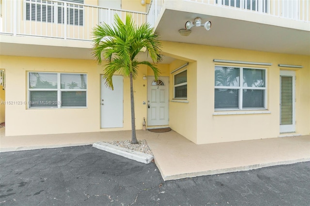 doorway to property with a patio