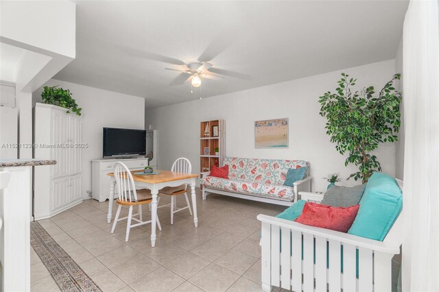 dining space with ceiling fan and light tile patterned floors