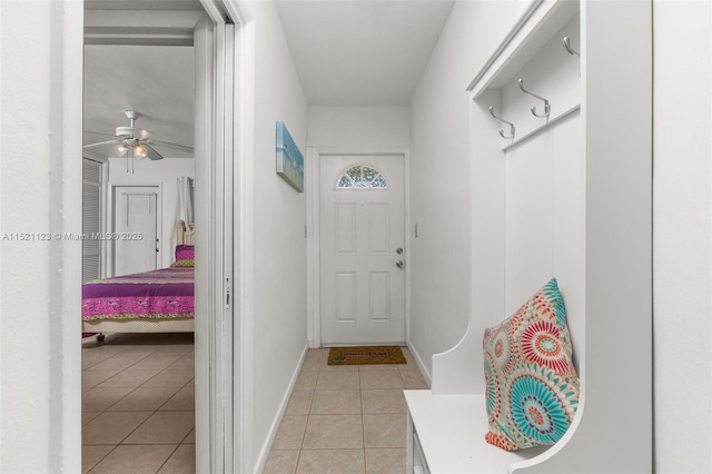 mudroom with light tile patterned floors and ceiling fan