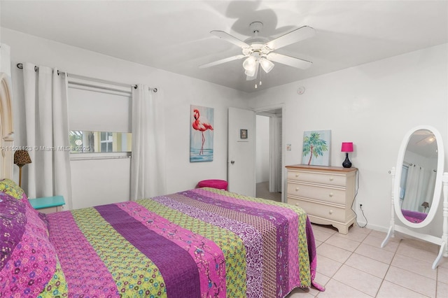 tiled bedroom with ceiling fan