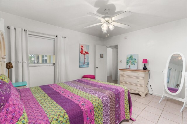 tiled bedroom with ceiling fan