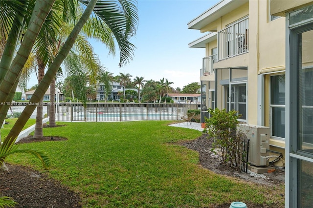 view of yard featuring a community pool