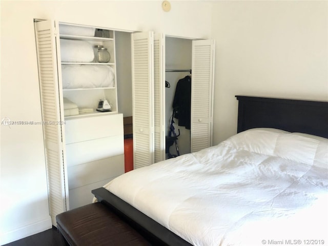 bedroom featuring two closets