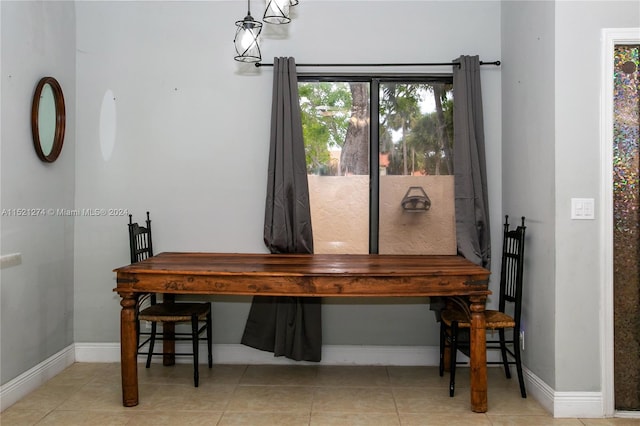 dining space with light tile flooring