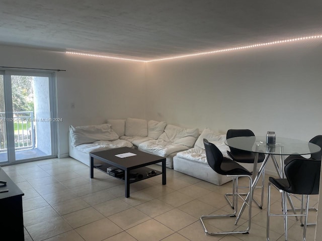 unfurnished living room with light tile floors