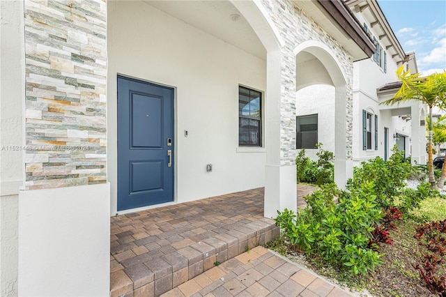 property entrance featuring covered porch