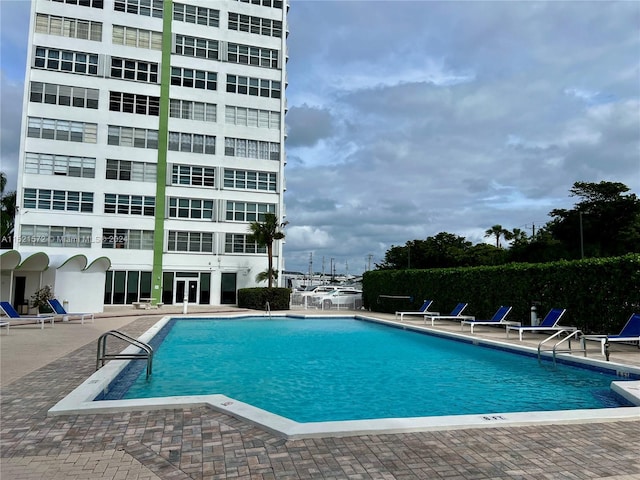 view of swimming pool with a patio