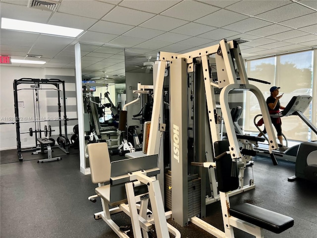 exercise room featuring a paneled ceiling